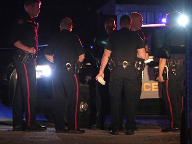 Police gather at the scene of an officer involved shooting in Dover in Calgary on Thursday night November 3, 2016.