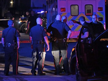 Police gather at the scene of an officer involved shooting in Dover in Calgary on Thursday night November 3, 2016.