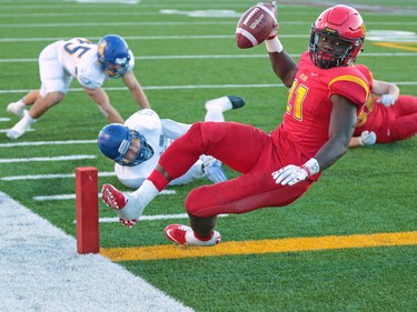 Calgary Dinos running back Jeshrun Antwi scores the winning touchdown in Hardy Cup action defeating the UBC Thunderbirds 46-43 at McMahon Stadium in Calgary on Saturday November 12, 2016.