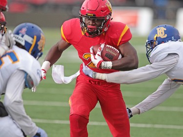 Calgary Dinos running back Jeshrun Antwi runs the ball against the UBC Thunderbirds during the Hardy Cup  at McMahon Stadium in Calgary on Saturday November 12, 2016.