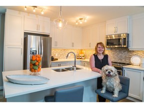 Katherine McNaught and her dog Cruz in the Verona show suite in Sage Hill by Trico Homes.