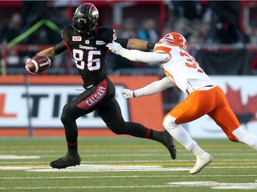 Calgary Stampeders Anthony Parker, lefts evades BC Lions Chandler Fenner in CFL Western Final action at McMahon Stadium in Calgary, Alta.. on Sunday November 20, 2016. Leah hennel/Postmedia