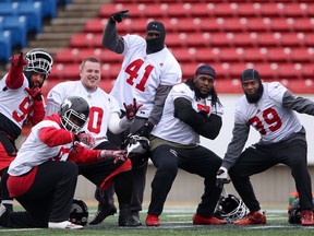 Calgary Stampeders defensive players ham it up for the camera during Stamps practice at McMahon Stadium in Calgary, Alta.. on Wednesday November 16, 2016. Leah hennel/Postmedia