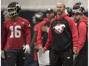 Calgary Stampeders head coach Dave Dickenson calls in plays as slotback Marquay McDaniel (16) stand by at practice for the 104th Grey Cup in Toronto on Wednesday, November 23, 2016.