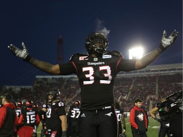 Calgary Stampeders Jerome Messam gets the crowd going during their game against the BC Lions in CFL Western Final action at McMahon Stadium on Sunday November 20, 2016. Leah hennel/Postmedia