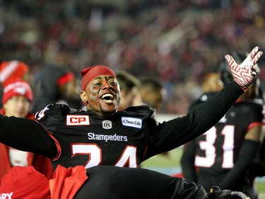 Calgary Stampeders Joe Burnett celebrates their win against the BC Lions during Western Final CFL action at McMahon Stadium in Calgary, Alta.. on Sunday November 20, 2016. Leah hennel/Postmedia