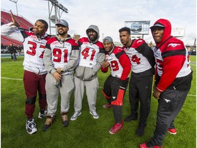 Calgary Stampeders pose for photos during a walkthrough ahead of the Grey Cup at BMO Field in Toronto, Ont. on Saturday November 26, 2016.