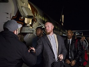Calgary Stampeders' quarterback Bo Levi Mitchell greets a friend as the Stampeders arrive in Toronto on Tuesday, November 22, 2016, ahead of the CFL final to be held in Toronto on Sunday.