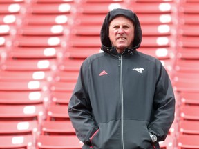 In his first season away from head coaching, Calgary Stampeders GM John Hufnagel watches from the stands during the team's rookie camp Friday May 27, 2016. The main camp opens Sunday. (Ted Rhodes/Postmedia) ORG XMIT: POS1605271333250792