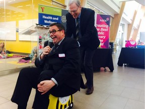 Paul McIntyre Royston (left) and Bill Ptacek (right) with Calgary Public Library take one of the new Read and Play kits out for a test drive on Monday November 28, 2016 in Calgary, AB