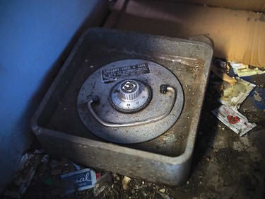 The floor safe shares space with discarded food wrappers.