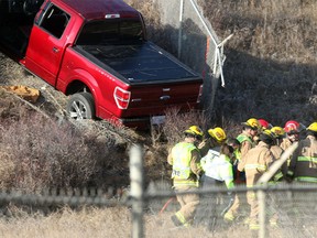 Fireghters carry a person from the wreckage of a truck involved in what appeared to be a single vehicle crash on  Tuesday morning November 22, 2016.