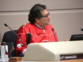 Calgary mayor Naheed Nenshi wears his Calgary Stampeders jersey in the city council meeting in honour of the Stamps victory over the BC  lions in Calgary, Alberta, on November 19, 2012. MIKE DREW/CALGARY SUN/QMI AGENCY