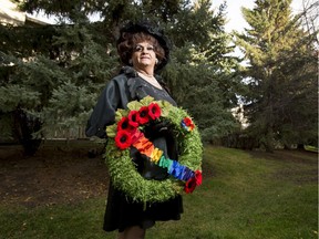 Mz. Rhonda poses for a photo at home in Calgary, Alta., on Wednesday, Nov. 2, 2016. Mz. Rhonda will make history on Nov. 11 when she'll mark the first time a drag queen has laid a wreath during Remembrance Day ceremonies in Calgary, intended to honour gay service members past and present. Lyle Aspinall/Postmedia Network
