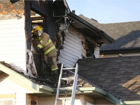 Fire crews are shown on scene at Coverton Heights N.E. on Saturday November 5, 2016 following a large house fire.