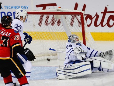 Calgary Flames Sean Monahan celebrates after a goal by Kris Versteeg against the Toronto Maple Leafs during NHL hockey in Calgary, Alta., on Wednesday, November 30, 2016.