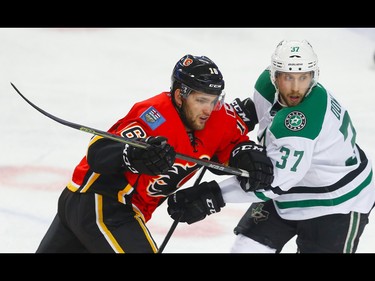Calgary Flames Linden Vey battles against Justin Dowling of the Dallas Stars during NHL hockey in Calgary, Alta., on Thursday, November 10, 2016. AL CHAREST/POSTMEDIA