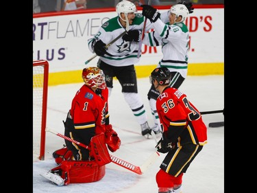 Calgary Flames Brian Elliott and Troy Brouwer react after giving up a goal to Lauri Korpikoski of the Dallas Stars during NHL hockey in Calgary, Alta., on Thursday, November 10, 2016. AL CHAREST/POSTMEDIA