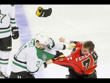 Micheal Ferland of the Calgary Flames fights Antoine Roussel of the Dallas Stars during NHL action in Calgary, Alta., on Thursday, Nov. 10, 2016. Lyle Aspinall/Postmedia Network