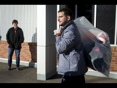 Calgary Stampeders kicker Rene Paredes carries a bag of belongings away from McMahon Stadium in Calgary, Alta., on Tuesday, Nov. 29, 2016. The Stamps were cleaning out their lockers two days after losing the Grey Cup to Ottawa in Toronto. Lyle Aspinall/Postmedia Network