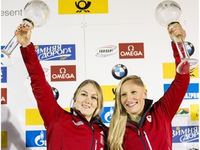 Melissa Lotholz, left, and Kaillie Humphries of Canada pose for a picture during the final ceremony of the two-women bobsleigh competition during the BMW IBSF Bob & Skeleton Worldcup on February 26, 2016 in Koenigsee, Germany.
