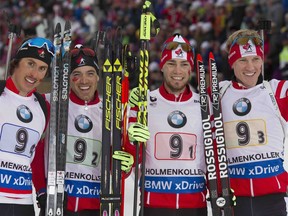 Canadas men's relay team of, left to right, Brendan Green, Nathan Smith, Christian Gow and Scott Gow celebrate after winning a bronze medal at the IBU World Championships in Oslo, Norway on March 12, 2016.