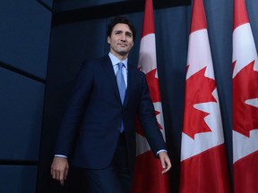 Prime Minister Justin Trudeau arrives to announce the approval of two pipelines at the National Press Theatre in Ottawa on Tuesday.
