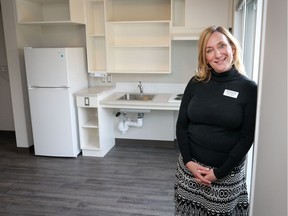 Kathy Christiansen of Resolve in one of the rooms at Aurora on the Park, ready for the buildingÕs future tenants to move in as early as Nov. 25. The support provided by Calgary Alpha House Society will include: 24-hour double-staffing, controlled entry, recreation therapy and other supports the tenants may need in Calgary, Ab., on Thursday November 24, 2016. Mike Drew/Postmedia