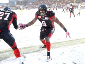 Kienan Lafrance (27) of the Ottawa Redblacks celebrates his late touchdown with Ernest Jackson (9) against the Edmonton Eskimos during second half of the CFL's East Division Final held at TD Place in Ottawa, November 20, 2016.  Photo by Jean Levac  ORG XMIT: 125313