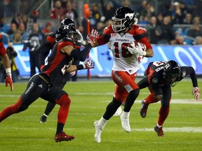 Marquay McDaniel of the Calgary Stampeders runs the ball against the Ottawa Redblacks during the 104th Grey Cup at BMO Field in Toronto, Ont. on Sunday November 27, 2016. Dave Abel/Toronto Sun/Postmedia Network