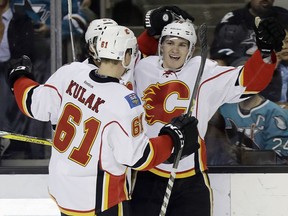 Calgary Flames' Matthew Tkachuk, right, celebrates his goal with teammate Brett Kulak (61) during the second period of an NHL hockey game against the San Jose Sharks on Thursday, Nov. 3, 2016, in San Jose, Calif.