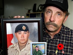 Murray Marshall, father of Sapper Steven Marshall, holds some pictures of his son killed in Afghanistan in 2009. (File photo)
