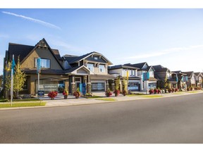 A show home parade of front-attached garage homes in Mahogany by Hopewell Residential.