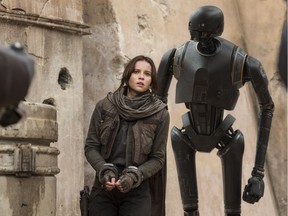 Felicity Jones (Jyn Erso), and K-2SO (Alan Tudyk) in Rogue One: A Star Wars Story.