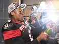 Ottawa Redblacks quarterback Henry Burris (1) sprays champagne as the Redblacks celebrate their Grey Cup win over the Calgary Stampeders in Toronto on Sunday, November 27, 2016.