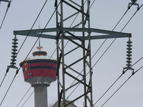 Photo shows the Calgary Tower framed behind power lines in downtown Calgary Jan 29/10. A bill is being proposed by the legislature may change how citizens are charged for their electricity.