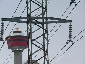 Photo shows the Calgary Tower framed behind power lines in downtown Calgary Jan 29/10. A bill is being proposed by the legislature may change how citizens are charged for their electricity. JIM WELLS/ QMI AGENCY ORG XMIT: p5powerlines300