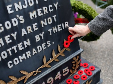 Poppies are placed on the cenotaph during the Remembrance Day service at the Military Museums in Calgary, Alta., on Friday November 11, 2016.