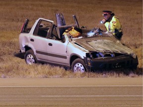 Police investigate the scene of a fatal rollover on southbound Deerfoot Trail between Beddington Trail and Airport trail on Tuesday evening November 29, 2016. GAVIN YOUNG/POSTMEDIA