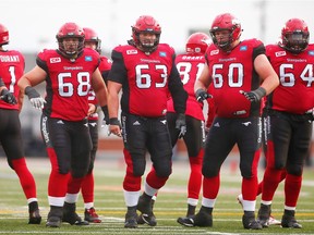 Calgary Stampeders O-line Spencer Wilson, Roman Grozman, Pierre Lavertu, Shane Bergman and Derek Dennis during CFL action in Calgary on Aug. 28, 2016.