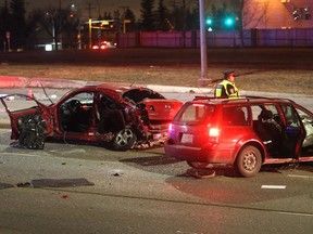 Police investigate a serious 2 car head on crash which sent at least one person to hospital in life threatening condition Thursday night November 17, 2016 at 16th Avenue and 19th Street NE. (Ted Rhodes/Postmedia Calgary )