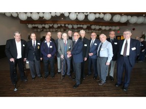 Secretary treasurer Ron Freckleton, centre, joins the oldest serving members of The Order of the Fourteen Old Time Salesmen of Alberta for their annual Christmas dinner at the Elks Club.