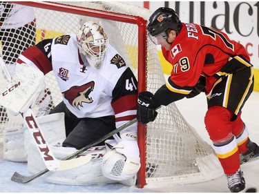 Micheal Ferland of the Calgary Flames tries a wrap around on Arizona Coyotes goalie Mike Smith during the second period at the Saddledome Wednesday November 16, 2016.