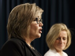 MLA Sandra Jansen, left, announced alongside Premier Rachel Notley on Thursday that she was leaving the Conservatives to sit with the NDP.