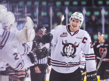 Adam Musil #25 of the Red Deer Rebels celebrates with the bench after scoring a hat-trick against the Calgary Hitmen during a WHL game at Scotiabank Saddledome on November 22, 2016 in Calgary.