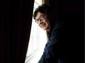 Musician and songwriter Robbie Robertson poses in Toronto on Monday, Oct. 7, 2013. Robbie Robertson swore off touring decades ago, but that doesn't mean the former guitarist for the Band doesn't have an immense collection of stories from the road.