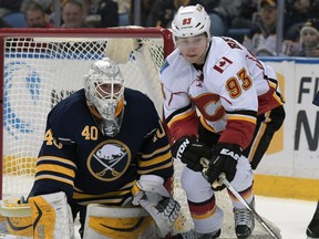 Buffalo Sabres goaltender Robin Lehner (40) eyes a rebound as Calgary Flames center Sam Bennett (93) closes in on the puck during the second period of an NHL hockey game, Thursday, March 3, 2016, in Buffalo, N.Y.