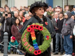 Ron Eberly - Mz. Rhonda - lays a wreath in memory of LGBTQ veterans at the cenotaph at Central Memorial Park for Remembrance Day ceremonies in Calgary, Ab., on Friday November 11, 2016.