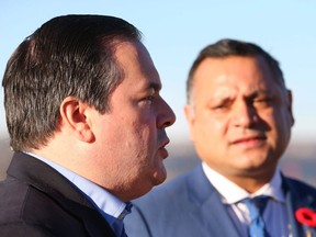 Jason Kenney (L) speaks and is accompanied by Alberta MLA Prab Gill (R) at a press event in Calgary on Friday November 4, 2016.
