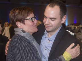 Colton Lewis gets a hug from Brenda Wiese after he was named the Youth Philanthropist of  the Year in the Generosity of Spirit Awards at the BMO Centre Tuesday November 15, 2016. He is an advocate for the Brett Wiese Memorial Scholarship at University of Calgary.